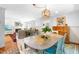 Open concept dining room, that flows to the living room and features a decorative light fixture at 2111 Woodland Ave, Raleigh, NC 27608