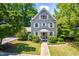 Charming two-story home with a well-manicured lawn and inviting front porch at 2111 Woodland Ave, Raleigh, NC 27608