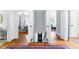 Upstairs hall with hardwood floors leading to multiple bedrooms at 2111 Woodland Ave, Raleigh, NC 27608