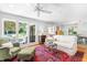 Spacious living room with plush seating, a large window, and access to the dining room at 2111 Woodland Ave, Raleigh, NC 27608