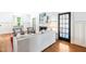 Cozy living area with hardwood floors, white walls, fireplace, comfortable seating, and natural light at 2111 Woodland Ave, Raleigh, NC 27608