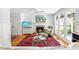 The living room has a fireplace, large windows, and plenty of natural light at 2111 Woodland Ave, Raleigh, NC 27608