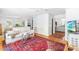 Bright and airy living room, with access to the kitchen, dining room, and the rest of the home at 2111 Woodland Ave, Raleigh, NC 27608