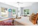Inviting bedroom with large windows, hardwood floors and light blue walls at 2111 Woodland Ave, Raleigh, NC 27608