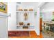 Charming mud room with built-in storage, white wainscoting and view to the dining area at 2111 Woodland Ave, Raleigh, NC 27608