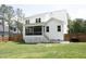 Expansive backyard featuring a screened porch and new fence, perfect for outdoor enjoyment at 2200 Mays Crossroads Rd, Louisburg, NC 27549
