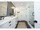 Stylish bathroom featuring double vanity, modern fixtures, and a glass-enclosed shower at 2200 Mays Crossroads Rd, Louisburg, NC 27549