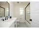Modern bathroom features a sleek vanity, subway tile shower, and black hardware fixtures at 2200 Mays Crossroads Rd, Louisburg, NC 27549