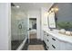 Bright bathroom featuring a tiled glass shower and sleek, modern vanity at 2200 Mays Crossroads Rd, Louisburg, NC 27549