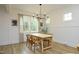 Bright dining room featuring modern chandelier, and wainscoting at 2200 Mays Crossroads Rd, Louisburg, NC 27549