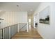 Upstairs hallway showcasing hardwood floors and bright lighting at 2200 Mays Crossroads Rd, Louisburg, NC 27549