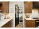 Well-lit kitchen showcases the pantry with a decorative glass door and abundant shelving at 2200 Mays Crossroads Rd, Louisburg, NC 27549