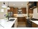 Well-designed kitchen with stainless steel appliances, a marble island, and wooden cabinets at 2200 Mays Crossroads Rd, Louisburg, NC 27549