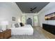 Comfortable main bedroom with a tray ceiling, stylish furnishings, and natural light at 2200 Mays Crossroads Rd, Louisburg, NC 27549