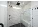 Modern glass-enclosed shower with sleek fixtures and marble-look tile at 2200 Mays Crossroads Rd, Louisburg, NC 27549