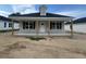 Charming home with a covered porch and well-maintained landscaping at 221 E Washington St, Coats, NC 27521