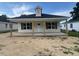 Charming single-story home with a welcoming porch, perfect for relaxing outdoors at 229 E Washington St, Coats, NC 27521