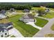 Aerial shot of home with a big yard, long drive, and manicured landscaping at 25 Deer Tail Ln # 52, Fuquay Varina, NC 27526