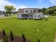 Expansive backyard with lush lawn, screened porch, and white exterior at 25 Deer Tail Ln # 52, Fuquay Varina, NC 27526