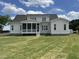 Large, level backyard offering plenty of space for outdoor activities and relaxation with a screened porch at 25 Deer Tail Ln # 52, Fuquay Varina, NC 27526