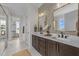 Luxurious bathroom with double vanity, unique mirrors, and modern fixtures creating a spa-like experience at 25 Deer Tail Ln # 52, Fuquay Varina, NC 27526