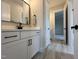 Modern bathroom with a white vanity, black hardware, and a sleek framed mirror at 25 Deer Tail Ln # 52, Fuquay Varina, NC 27526