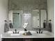 Elegant bathroom featuring dual sinks, modern fixtures, decorative tile, and stylish lighting at 25 Deer Tail Ln # 52, Fuquay Varina, NC 27526