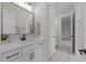 Bathroom with a white vanity, black hardware, and ample natural light at 25 Deer Tail Ln # 52, Fuquay Varina, NC 27526