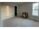 Unfinished bedroom with bright window and doorway to closet and adjacent rooms at 25 Deer Tail Ln # 52, Fuquay Varina, NC 27526
