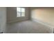 Bright bedroom featuring natural light and a view of the outdoors at 25 Deer Tail Ln # 52, Fuquay Varina, NC 27526