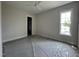 Spacious bedroom with a bright window, closet, and neutral color palette at 25 Deer Tail Ln # 52, Fuquay Varina, NC 27526