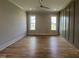 Expansive bedroom features hardwood floors, recessed lighting and abundant natural light at 25 Deer Tail Ln # 52, Fuquay Varina, NC 27526