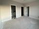 Spacious bedroom featuring multiple doorways at 25 Deer Tail Ln # 52, Fuquay Varina, NC 27526