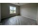 Sunlit bedroom with a large window offering a pleasant view, awaiting your personal touch at 25 Deer Tail Ln # 52, Fuquay Varina, NC 27526