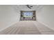 Bonus room showcasing a window seat flanked by built-in shelving, and neutral colored walls at 25 Deer Tail Ln # 52, Fuquay Varina, NC 27526