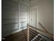 These built-in bookshelves and a view of the staircase railing add character to the room's architectural design at 25 Deer Tail Ln # 52, Fuquay Varina, NC 27526