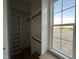 Closet featuring a window and open shelving with chrome closet rod fixtures at 25 Deer Tail Ln # 52, Fuquay Varina, NC 27526