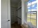 Bright walk-in closet with custom shelving and a scenic view from the window at 25 Deer Tail Ln # 52, Fuquay Varina, NC 27526
