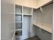 Walk-in closet with a custom shelving and hanging system, providing ample storage at 25 Deer Tail Ln # 52, Fuquay Varina, NC 27526