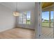 Bright dining room featuring hardwood floors and a view to the outside at 25 Deer Tail Ln # 52, Fuquay Varina, NC 27526