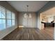Spacious dining room featuring hardwood floors, crown molding, and a large window, perfect for entertaining at 25 Deer Tail Ln # 52, Fuquay Varina, NC 27526