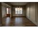 Dining room with hardwood floors, paneled walls, decorative lighting and adjacent to the entry and kitchen at 25 Deer Tail Ln # 52, Fuquay Varina, NC 27526