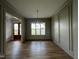 Elegant dining room featuring hardwood floors, detailed trim, and natural light at 25 Deer Tail Ln # 52, Fuquay Varina, NC 27526