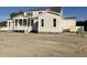 Two-story home boasting a covered porch, white siding, dark roof, complemented by the surrounding landscape at 25 Deer Tail Ln # 52, Fuquay Varina, NC 27526
