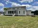 Side view of home featuring covered porch and well manicured lawn at 25 Deer Tail Ln # 52, Fuquay Varina, NC 27526