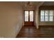 Bright foyer with hardwood floors, double doors, and large windows, providing an elegant and welcoming entrance at 25 Deer Tail Ln # 52, Fuquay Varina, NC 27526