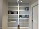 Hallway with built-in shelving offering space for books and decor at 25 Deer Tail Ln # 52, Fuquay Varina, NC 27526