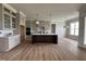 Modern kitchen featuring custom cabinets, oversized island, and stainless steel appliances at 25 Deer Tail Ln # 52, Fuquay Varina, NC 27526