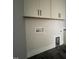 Laundry room with upper cabinets and utility hookups at 25 Deer Tail Ln # 52, Fuquay Varina, NC 27526
