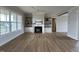 Bright living room with hardwood floors, built-in shelves, and a cozy fireplace at 25 Deer Tail Ln # 52, Fuquay Varina, NC 27526